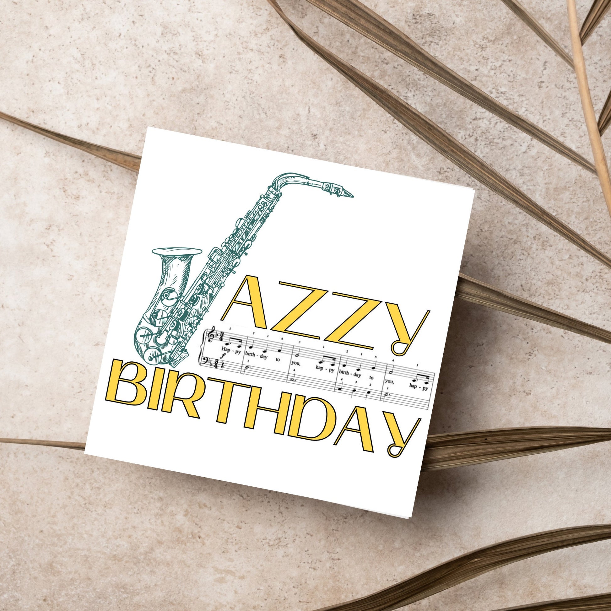 The Birthday Card has an image of a saxaphone in the shape of a &#39;J&#39; along with the word have a Jazzy Birthday. The Card depicts a music sheet of Happy Birthday. This Card is ideal for musicians
