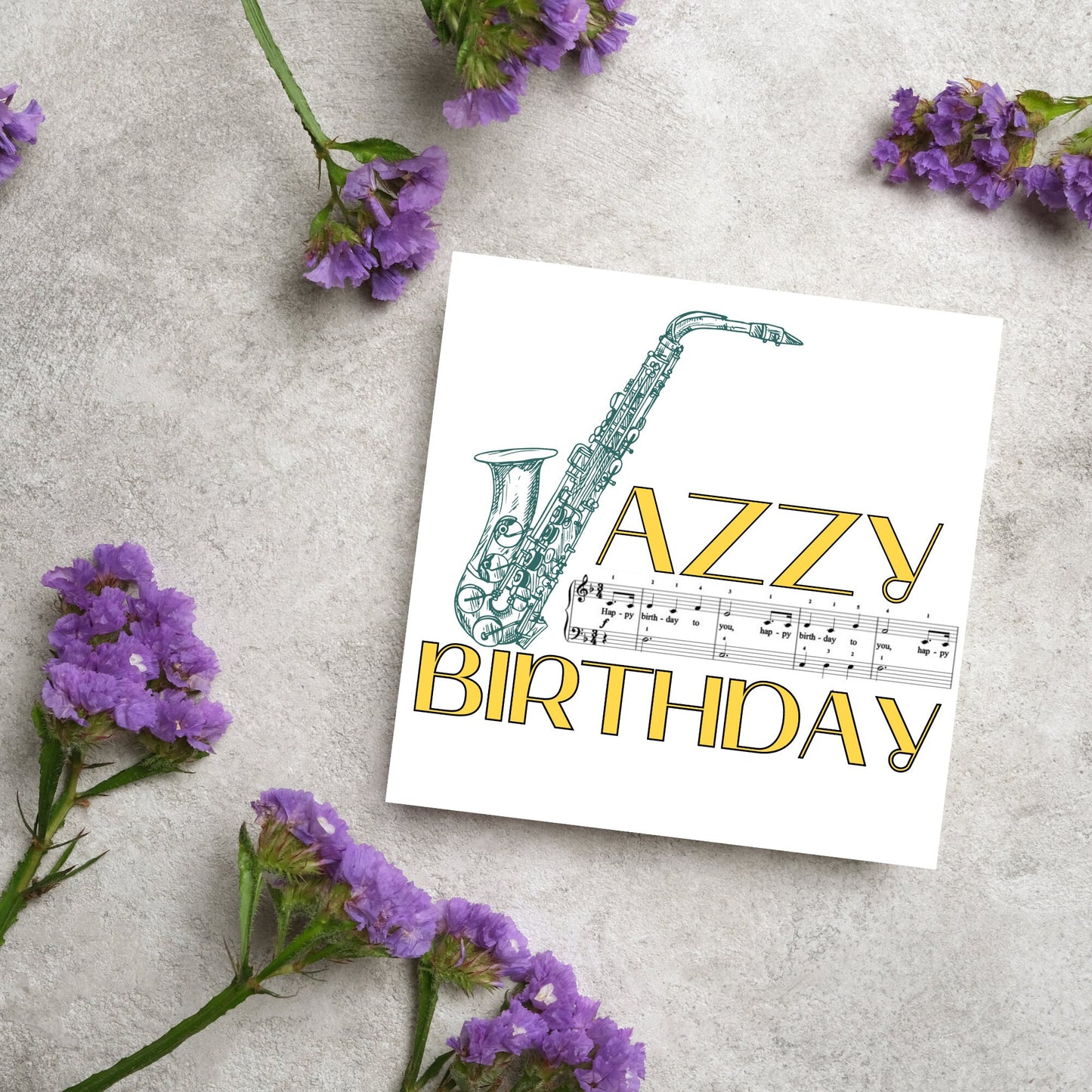 The Birthday Card has an image of a saxaphone in the shape of a &#39;J&#39; along with the word have a Jazzy Birthday. The Card depicts a music sheet of Happy Birthday. This Card is ideal for musicians