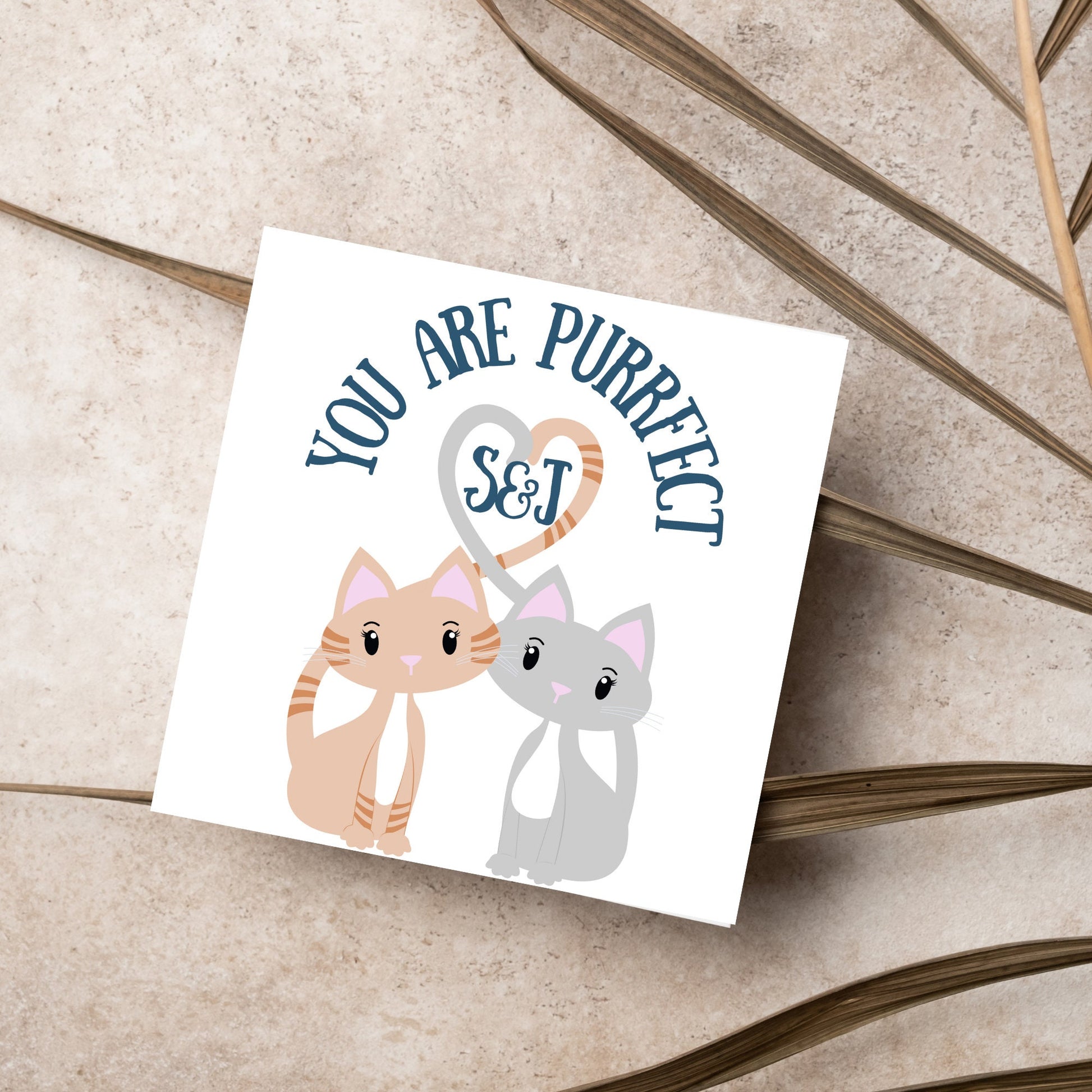 The Square Card has two cute illistration of cats with tails which lock to form a heart shape. Inside the heart is the personalisable initals of your loved one. The card reads &#39;You are Purrfect&#39;. This anniversary/valentines day card is cute