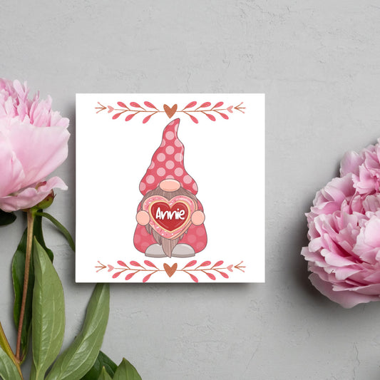 The Square Card has a cute gonk holding a love heart with a perssonalised name, the card has a cute heart header and footer, The Card is a cute representation of love, The Card is perfect for your valentines