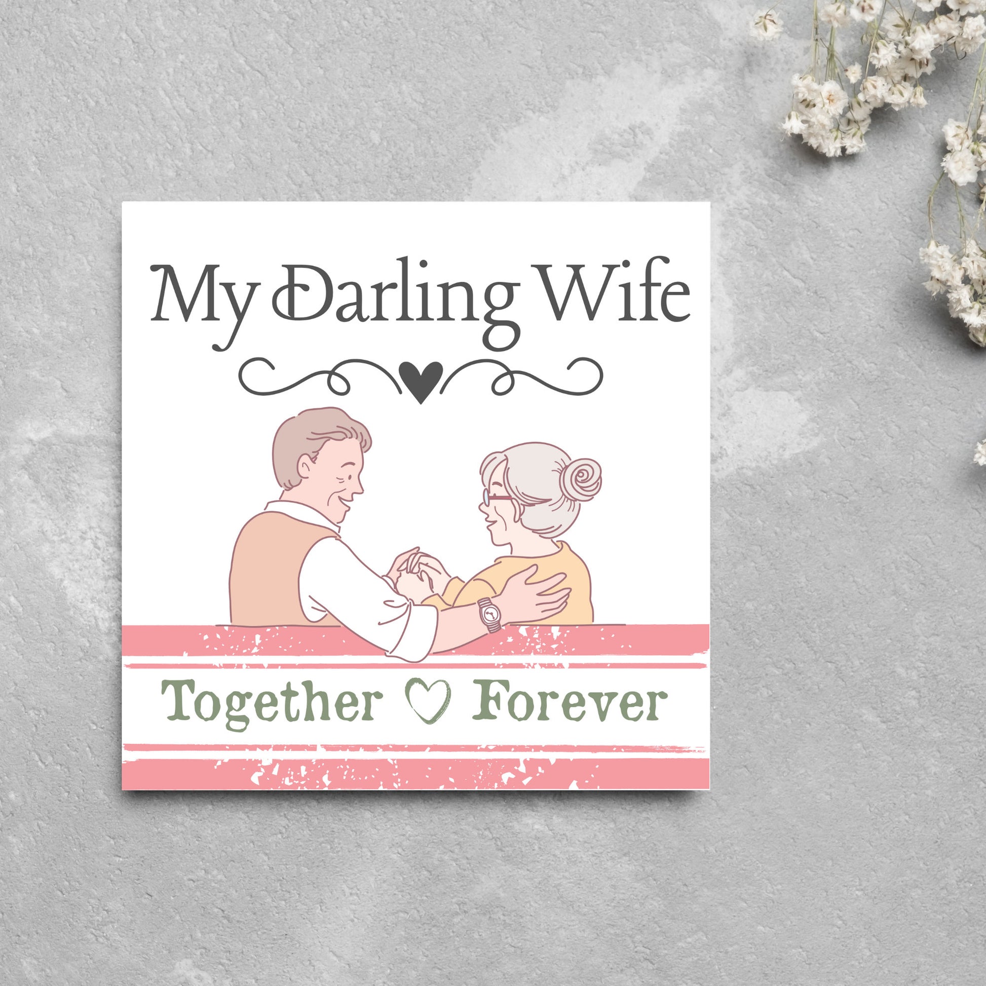 The Card has an illistration of a married couple holding hands. The Caption Reads &#39;My Darling Wife - Together Forever&#39;. The Card is printed in pastel tones and is perfect for anniversaries or valentines day.
