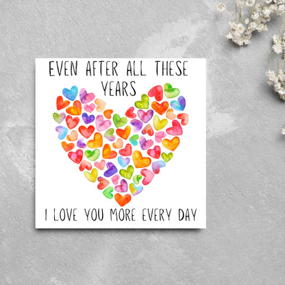 square card with colourful watercolour hearts making one big heart and the text &#39;even after all these years, i love you more everyday&#39; in a handwritten style font