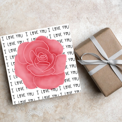 simple elegant card for valentines or anniversary, featuring a large pink rose  painting with a background of handwritten style text that repeats &#39;I love you&#39; with hearts instead of o&#39;s