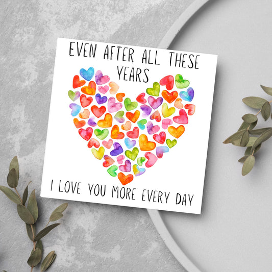 square card with colourful watercolour hearts making one big heart and the text &#39;even after all these years, i love you more everyday&#39; in a handwritten style font