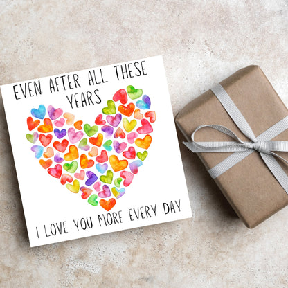 square card with colourful watercolour hearts making one big heart and the text &#39;even after all these years, i love you more everyday&#39; in a handwritten style font