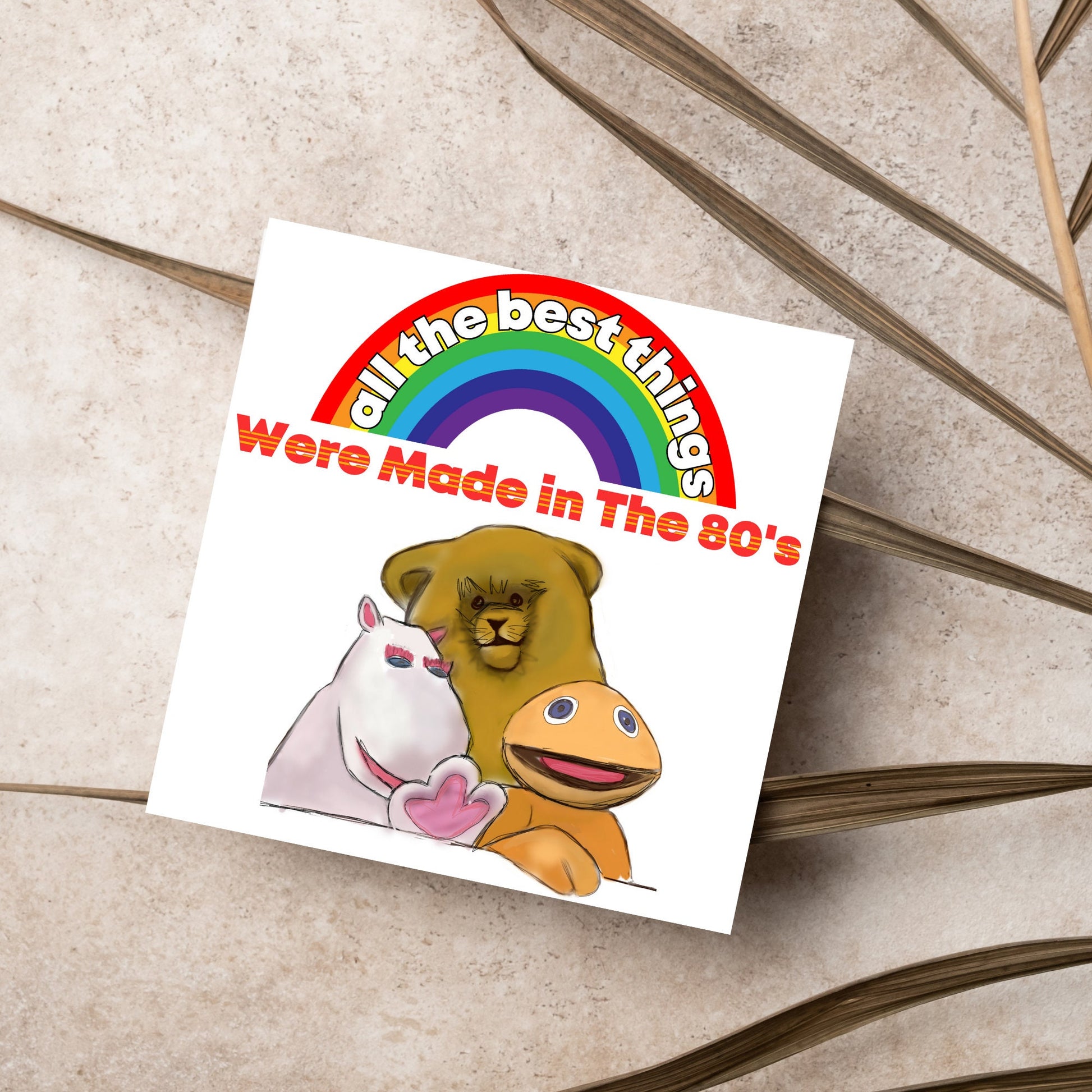 square card featuring an illustration of the characters from the tv show rainbow with a rainbow and red text that reads  &#39;all the best things were&#39; made in the 80&#39;s&#39; in the font from the shows title