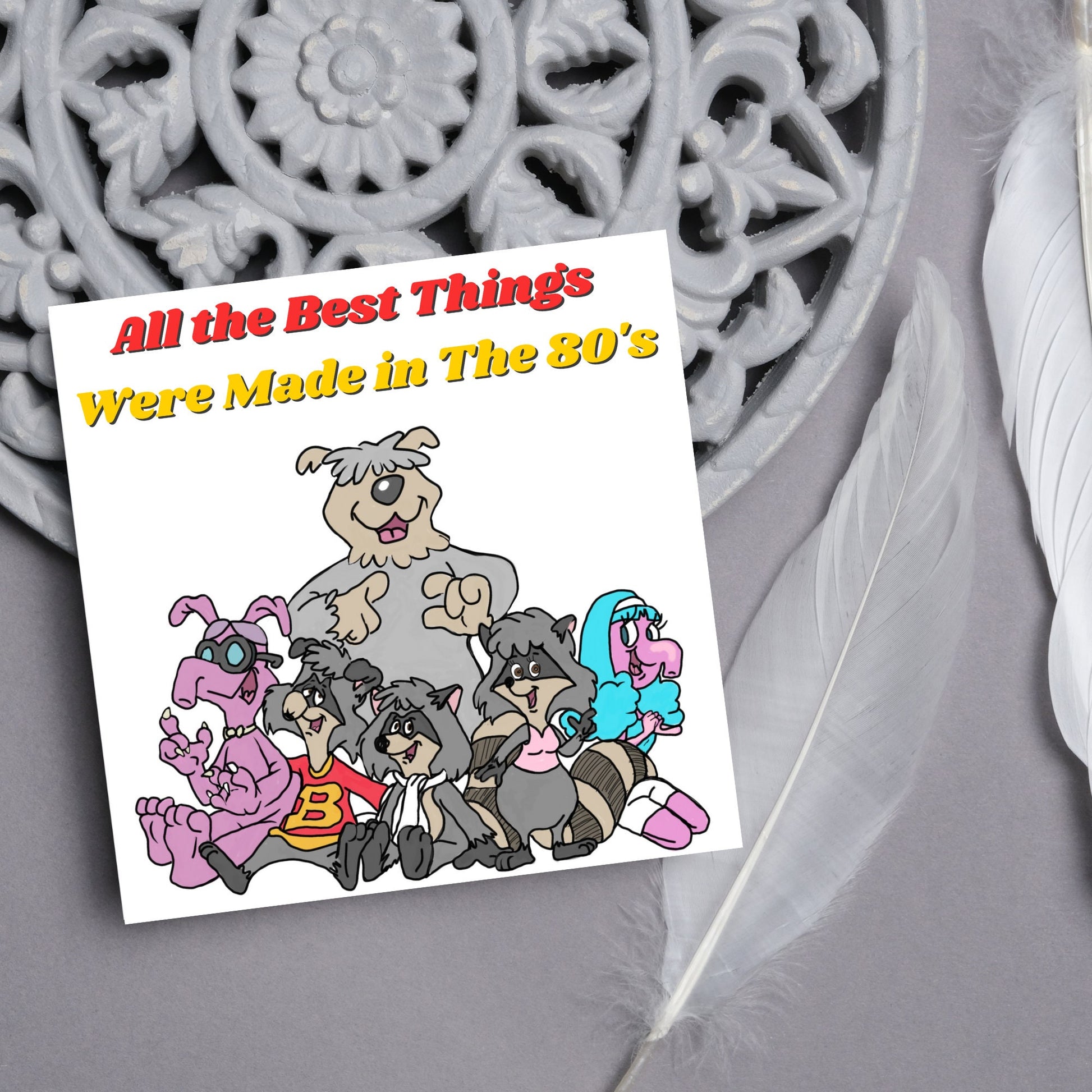 square card featuring an illustration of the raccoons from the tv cartoon with yellow and red text that reads  &#39;all the best things were&#39; made in the 80&#39;s&#39; in the font from the shows title