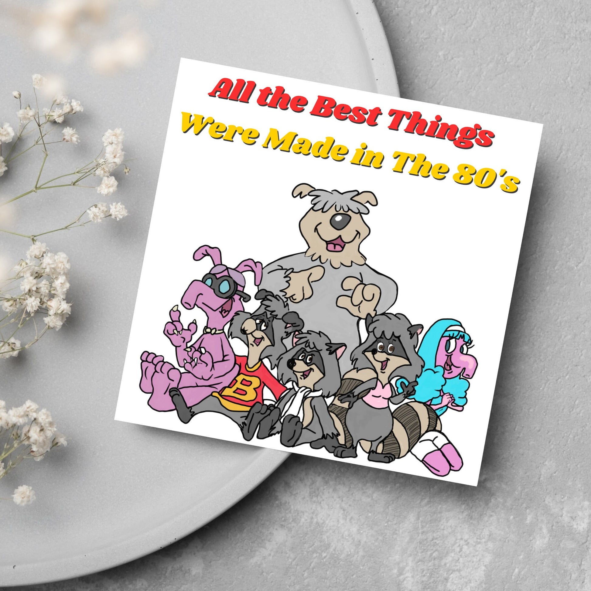 square card featuring an illustration of the raccoons from the tv cartoon with yellow and red text that reads  &#39;all the best things were&#39; made in the 80&#39;s&#39; in the font from the shows title