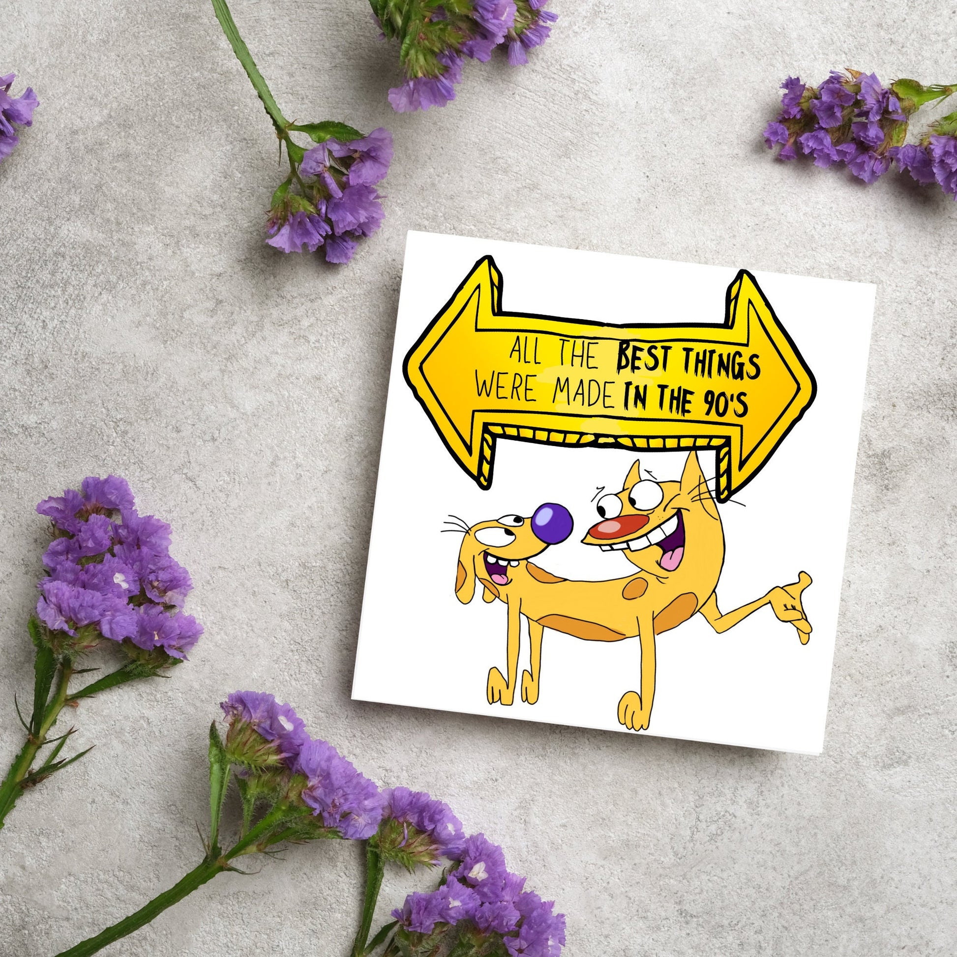 square card featuring an illustration of catdog with a yellow and black sign above them with the text that reads  &#39;all the best things were&#39; made in the 90&#39;s&#39; in the font from the shows title