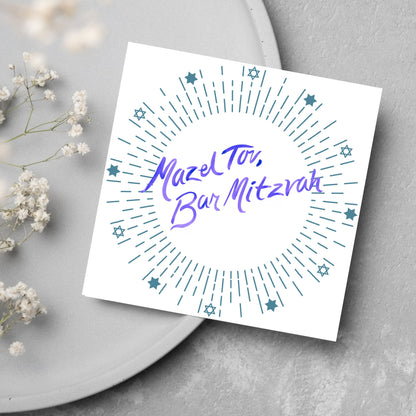 square bar mitzvah card with a white background and the text &#39;mazel tav, bar mitzvah&#39; in the centre in a blue handwritten script style font. Surrounding the text is a circle made of concentric blue lines and 12 stars of david