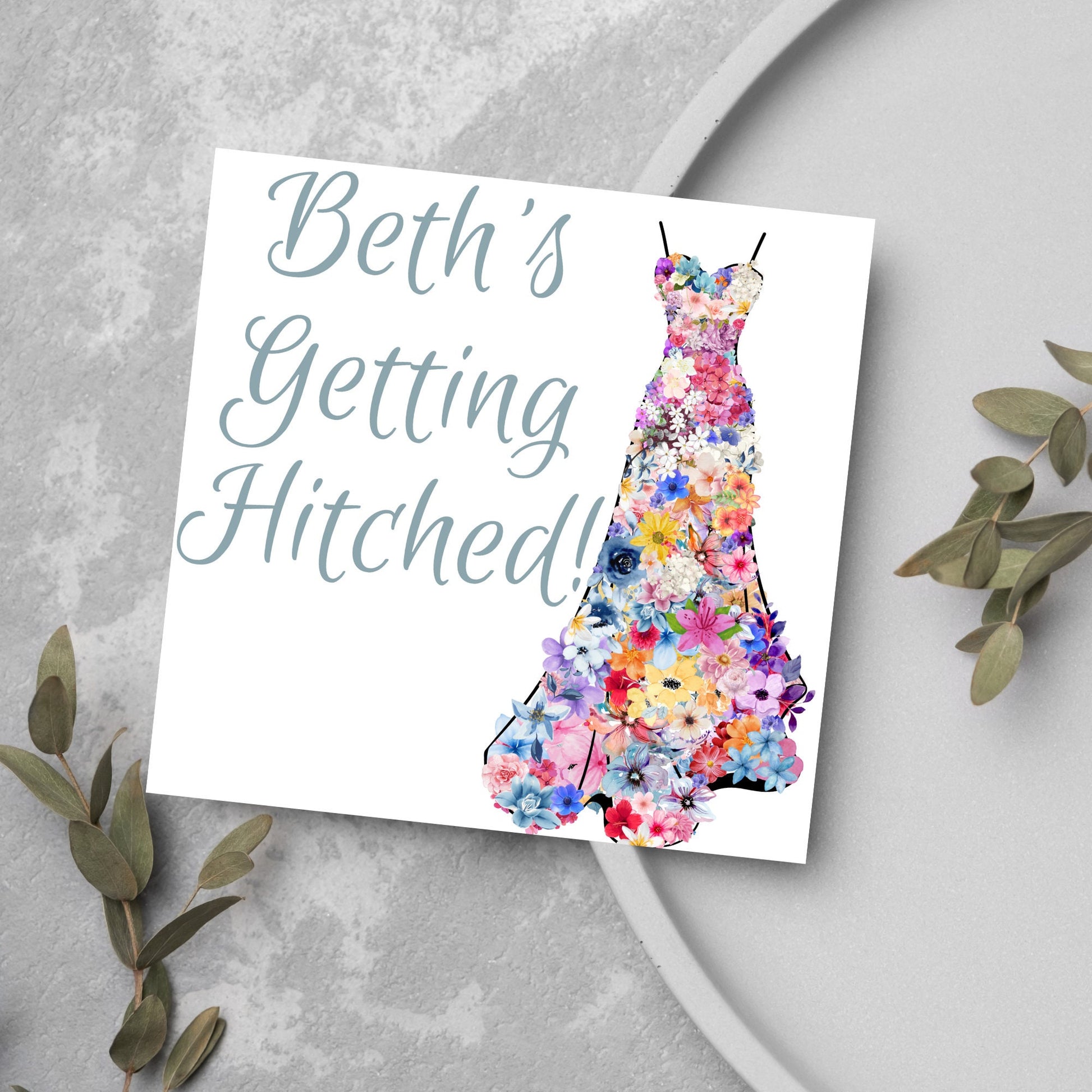 card with wedding dress made of flowersb and beths getting hitched text