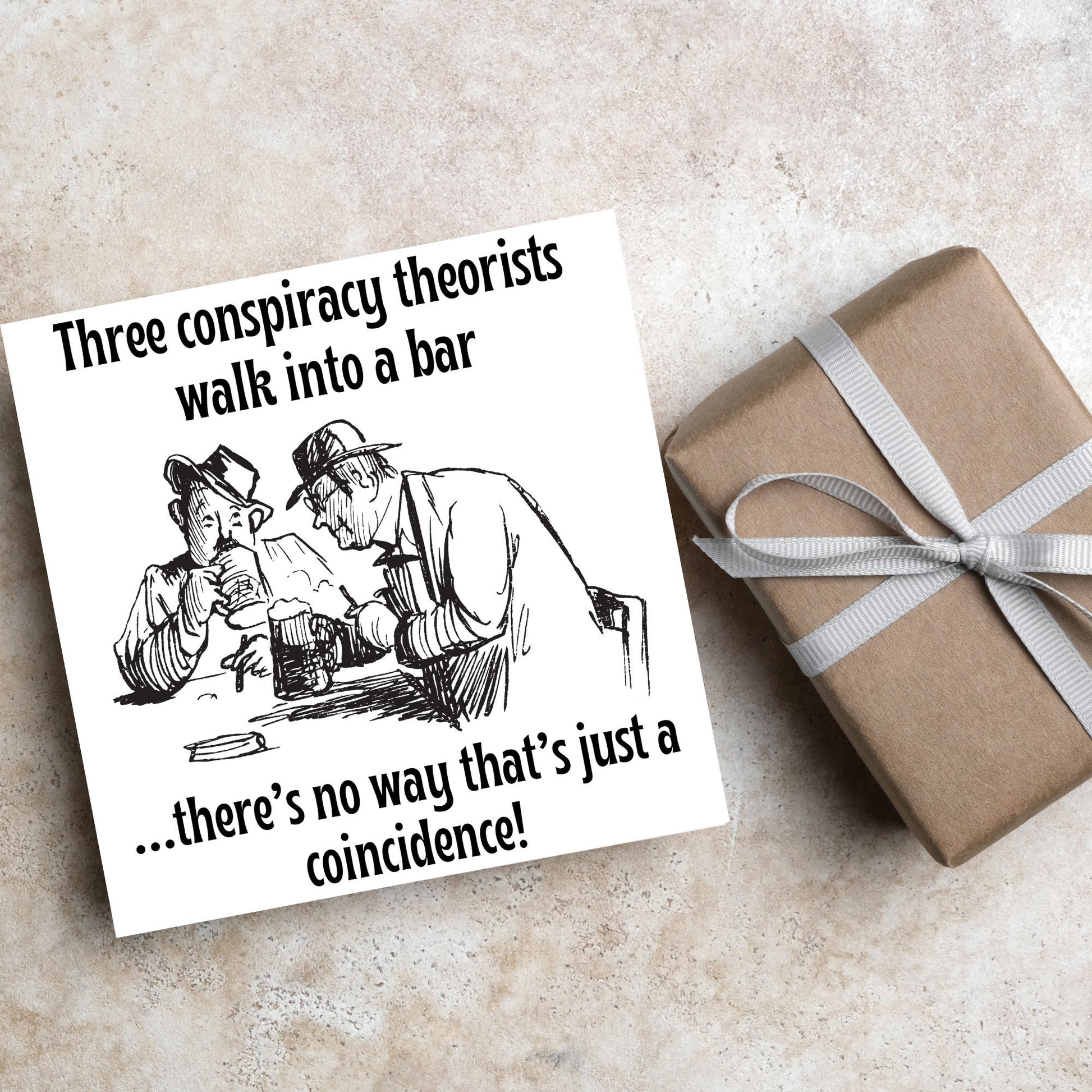 Image of a square greetings card with a hand drawn black and white line cartoon sketch of two old men at a bar drinking beer with the text- 3 conspiracy theorists walk into a bar....there&#39;s no way that&#39;s just a coincidence!