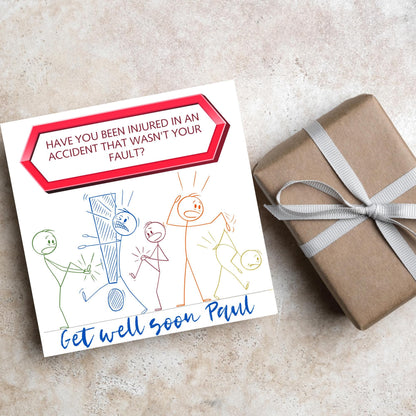 Square Get well soon card with a red sign which says have you been injured in an accident that wasn&#39;t your fault? above stick person cartoons of various injuries. Underneath is a handwritten style message that reads get well soon paul