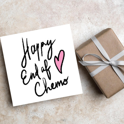 Simple square card with a white backdrop and black handwritten style text that reads HAPPY END OF CHEMO with a roughly drawn pink heart next to the text.