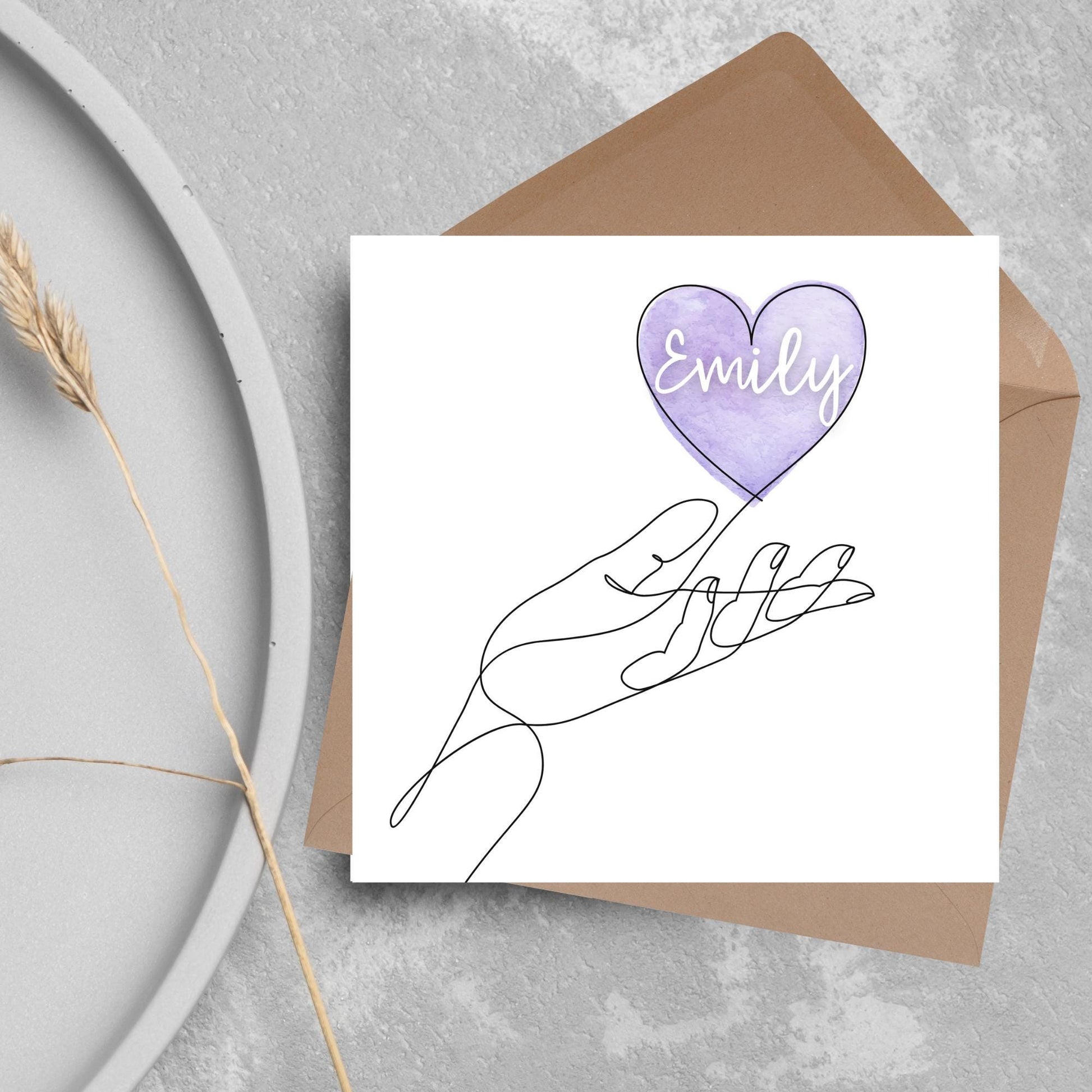 square card with a simple black and white one line drawing of an open hand with a heart rising from the hand. the heart has a purple background and has a personalised name written in a white cursive text