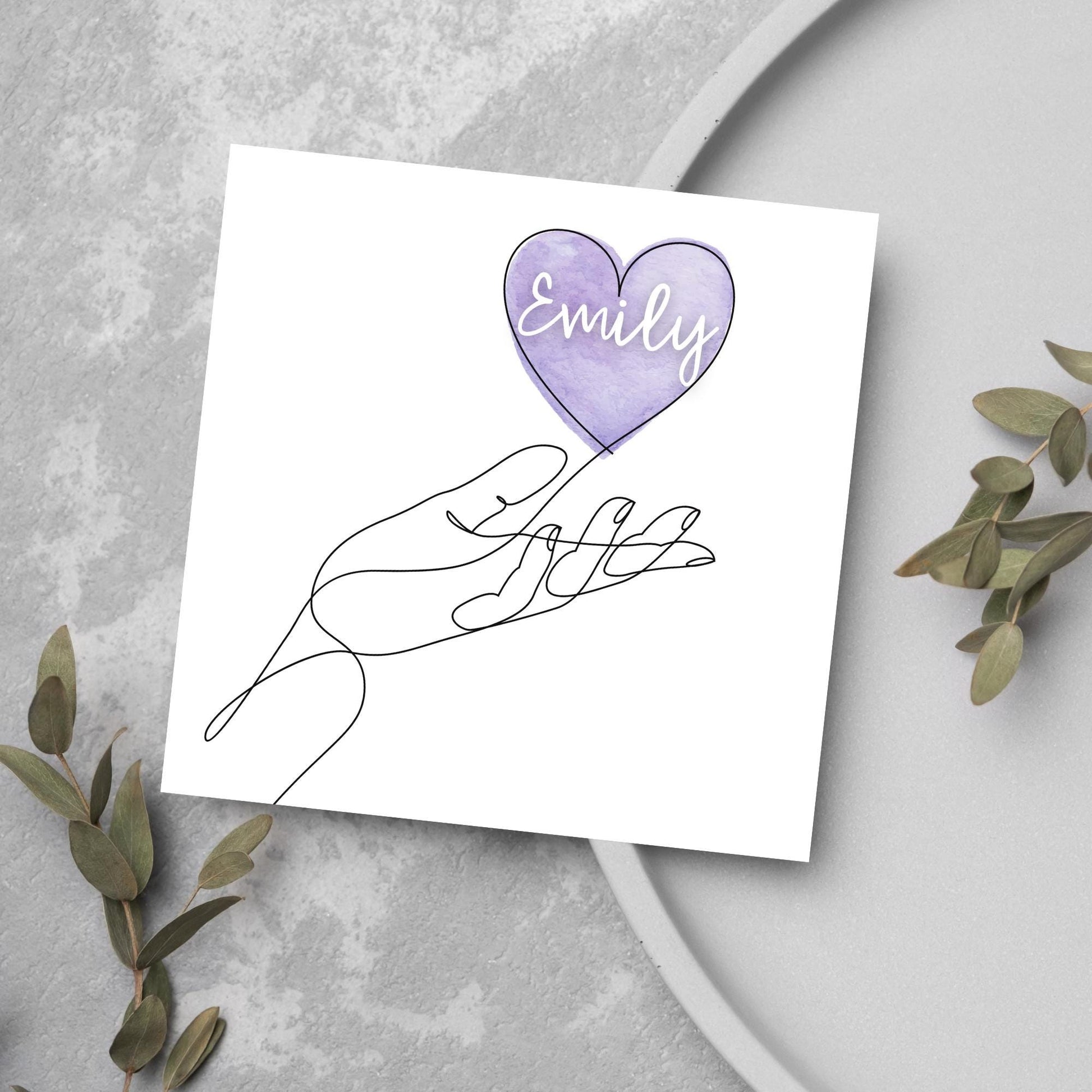 square card with a simple black and white one line drawing of an open hand with a heart rising from the hand. the heart has a purple background and has a personalised name written in a white cursive text