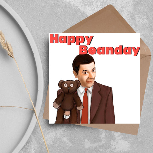 square card with a hand drawn image of Mr bean holding his teddy pooky with a cheeky smile on his face with the words Happy Beanday above in bold red text