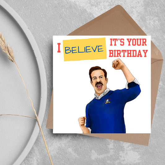 square greetings card with a hand drawn image of Jason Sudeikis character Ted Lasso giving a fist pump with the text - I believe it&#39;s your birthday