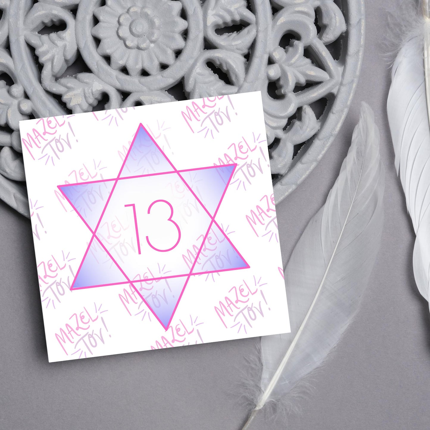 square Bat Mitzvah card with a pink line star of david with the number 13 with a purple gradient backing against the words Mazel Tov repeated as a backdrop