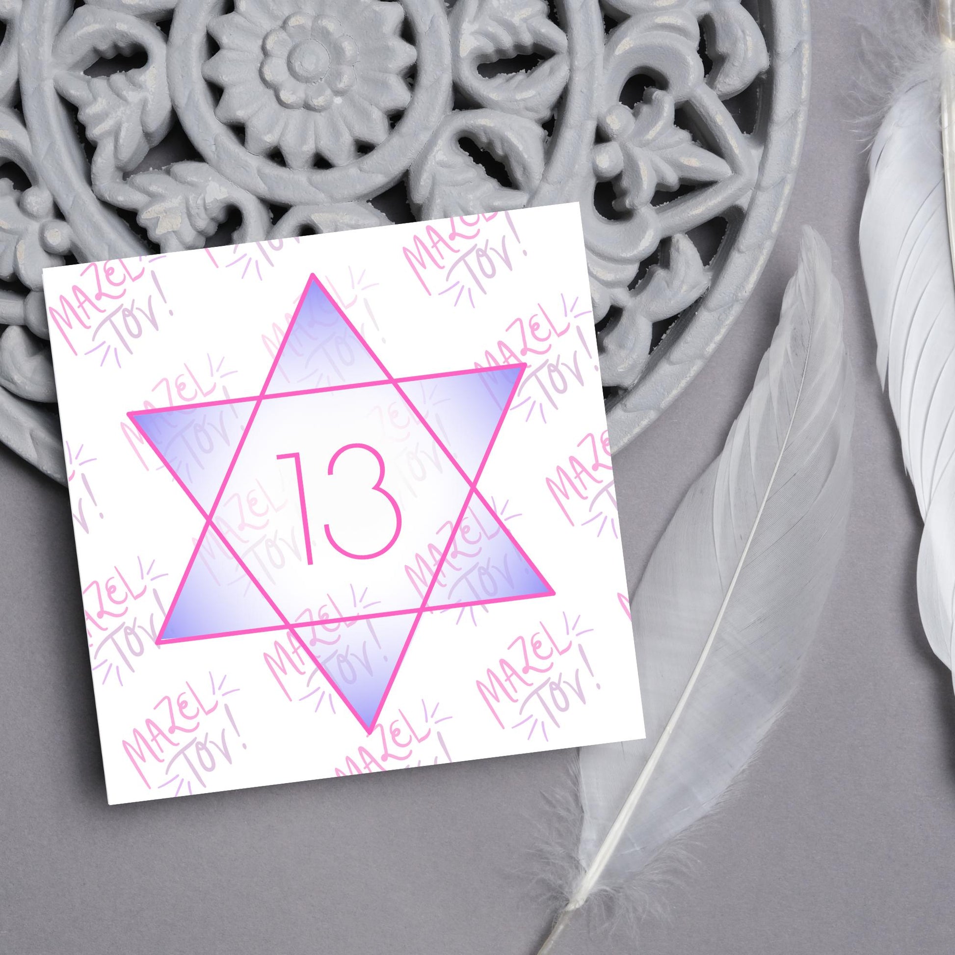 square Bat Mitzvah card with a pink line star of david with the number 13 with a purple gradient backing against the words Mazel Tov repeated as a backdrop