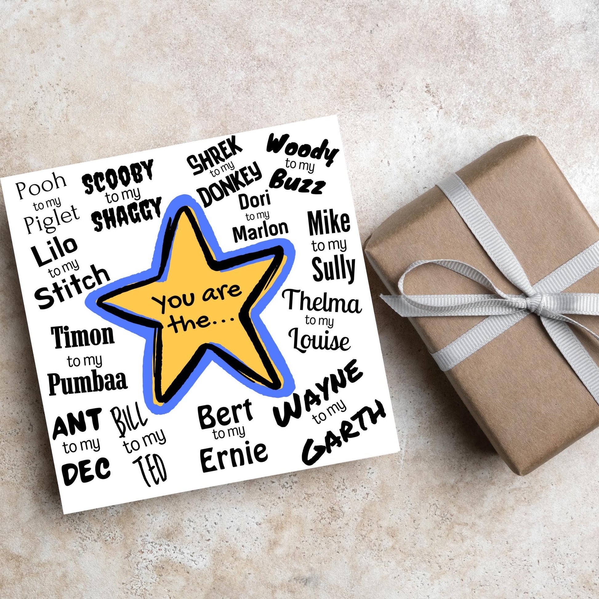 Square card with a blue and yellow star in the centre with black text - you are the... - and various famous friendship duos. for example thelma to my louise, lilo to my stitch, woody to my buzz, pooh to my piglet etc
