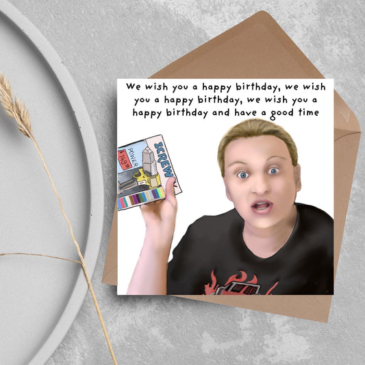 Square birthday card with a hand drawn image of Kerry from this country looking shocked and holding up a screwfix catalogue with the text we wish you a happy birthday, we wish you a happy birthday, we wish you a happy birthday and have a good time