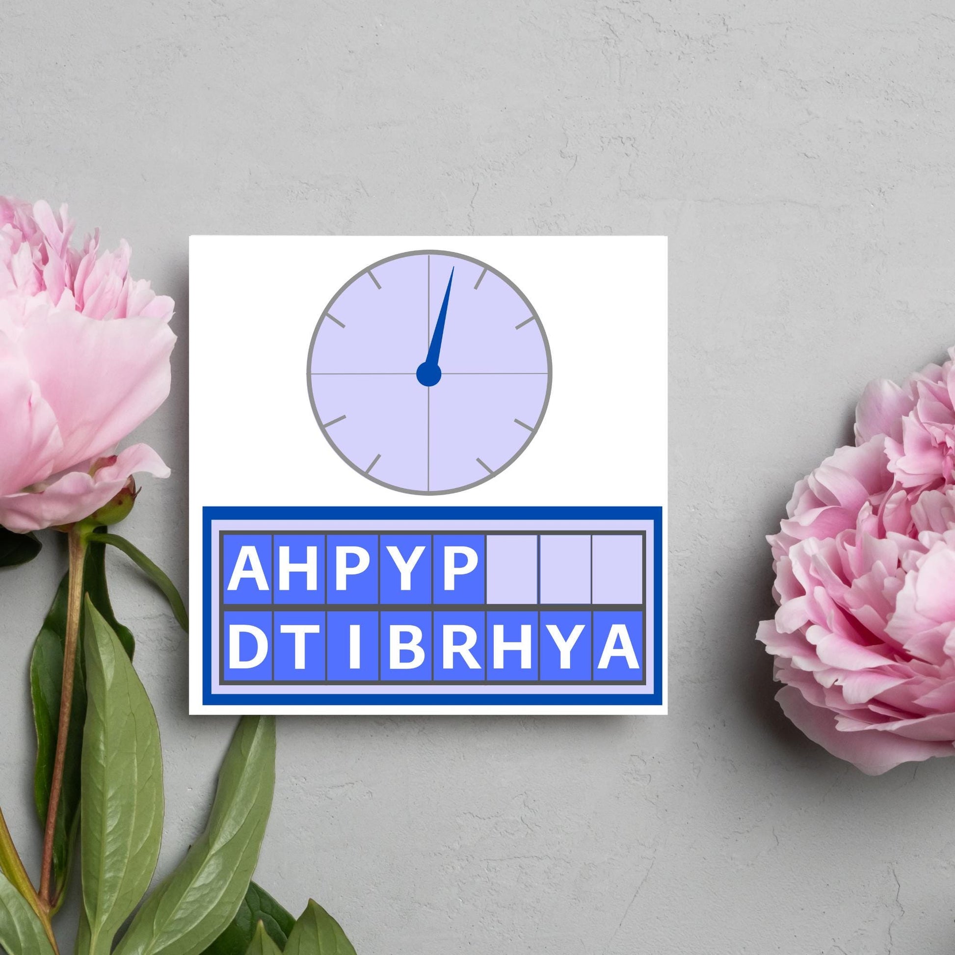 Square birthday card with a countdown theme with the clock and jumbled up letters that spell happy birthday