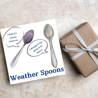 Image of a square greeting card. The card has a white backdrop with an illustration of two spoons with speech bubbles. One says I think it&#39;s raining tomorrow. The other says I thought it was going to be sunny? Underneath the illustration in a blue font is the text Weather Spoons