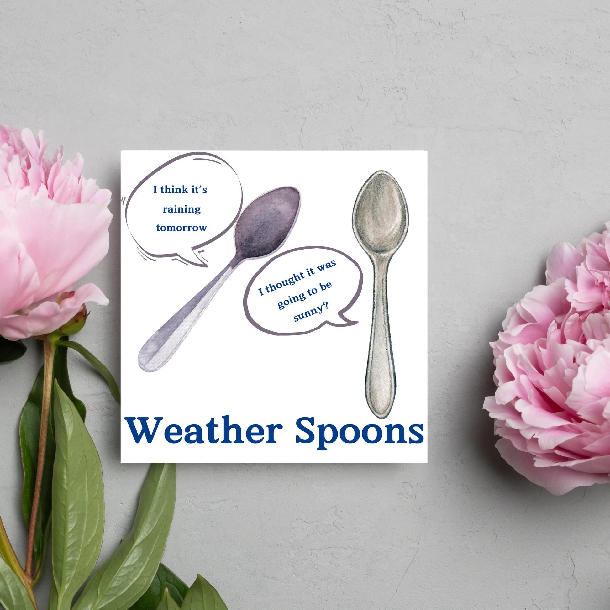 Image of a square greeting card. The card has a white backdrop with an illustration of two spoons with speech bubbles. One says I think it&#39;s raining tomorrow. The other says I thought it was going to be sunny? Underneath the illustration in a blue font is the text Weather Spoons