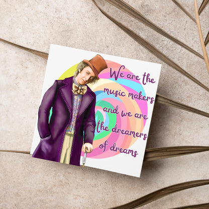 Image of a square greeting card. The background of the card is white and there is a hand drawn image of Gene Wilder as Willy Wonka wearing his purple coat, top hat and bow tie. Behind him is a colourful swirly lollypop and purple text reads &#39;we are the music makers and we are the dreamers of dreams&#39; in a curly font.
