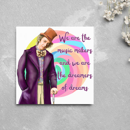 Image of a square greeting card. The background of the card is white and there is a hand drawn image of Gene Wilder as Willy Wonka wearing his purple coat, top hat and bow tie. Behind him is a colourful swirly lollypop and purple text reads &#39;we are the music makers and we are the dreamers of dreams&#39; in a curly font.