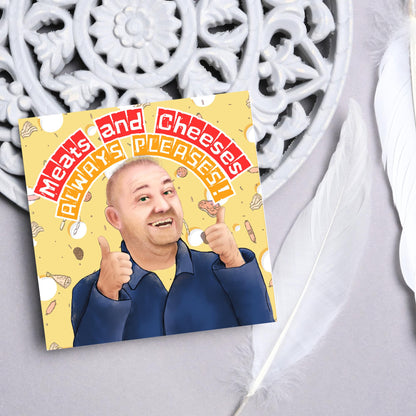 Square greeting card with a hand drawn image of Bob MOrtimer with 2 thumbs up against a backdrop of swiss cheese and various illustrations of different types of meat, with arched text that reads &#39;meats and cheeses always pleases&#39;